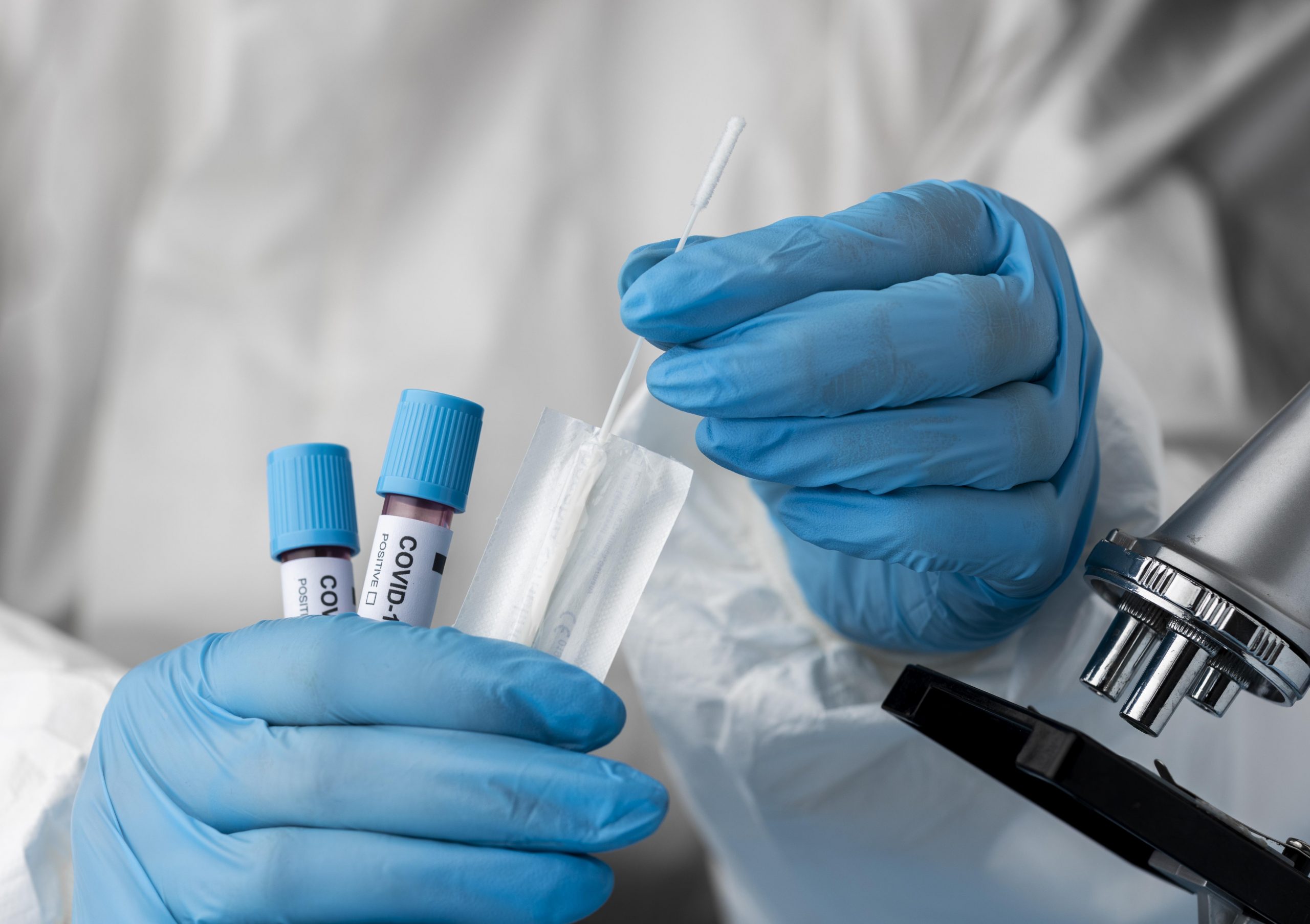 doctor-analyzing-blood-samples-with-microscope