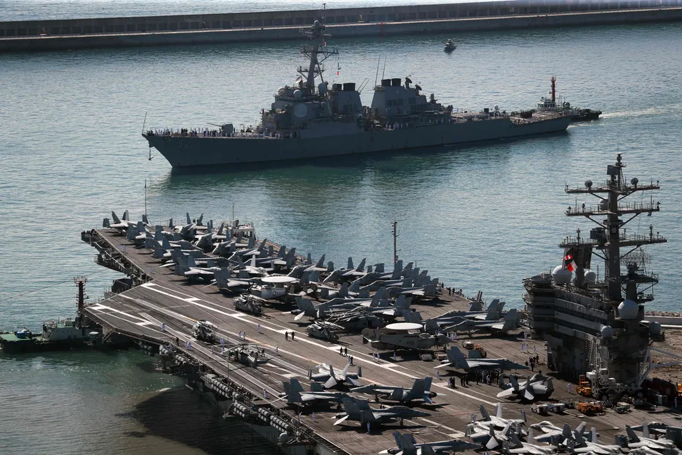 100594692-the-us-navys-nuclear-powered-uss-ronald-reagancvn-76-aircraft-carrier-bottom-and-uss-barr